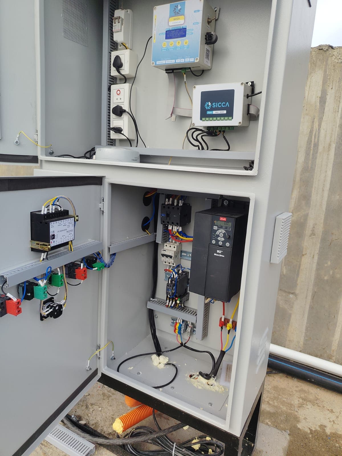 Two-compartment irrigation control cabinet with a VFD