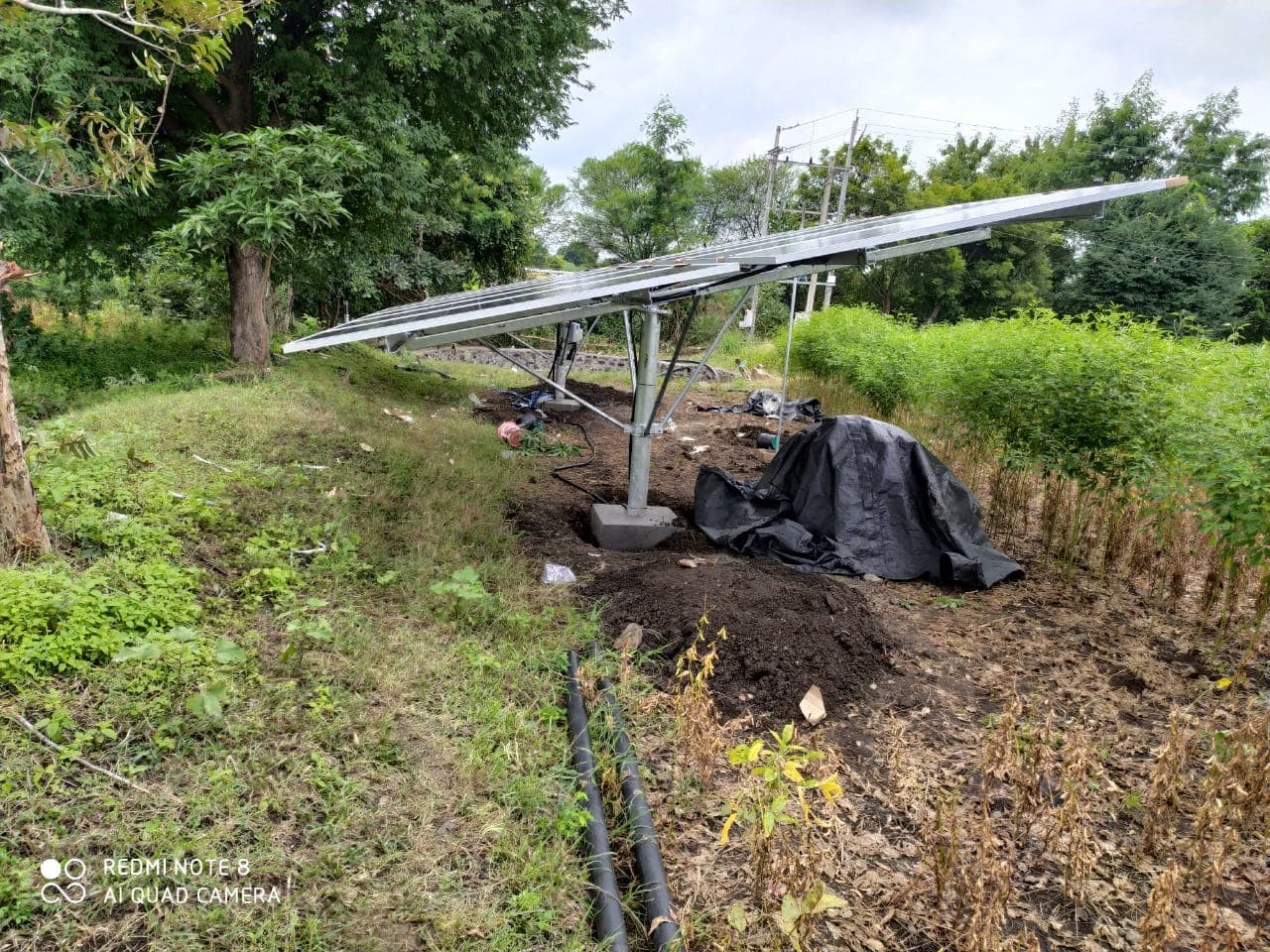 Ground-mounted solar array feeding a borewell pump